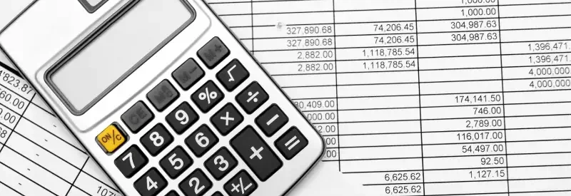 calculators and financial documents from an operating account audit