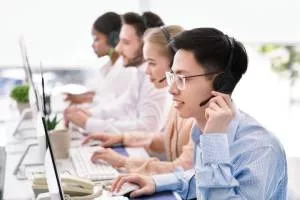 IT support employees helping customers. 