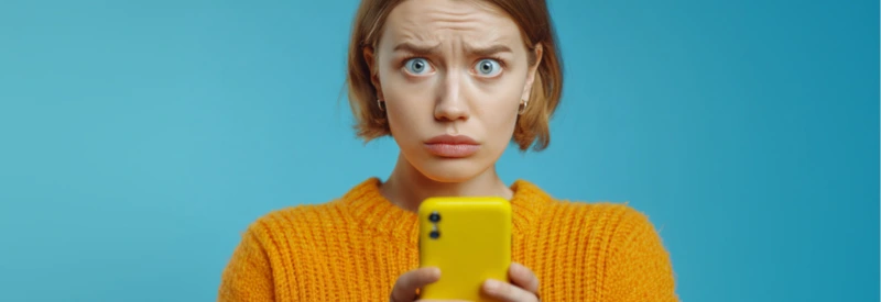 woman looking at her phone because of a venmo business scam