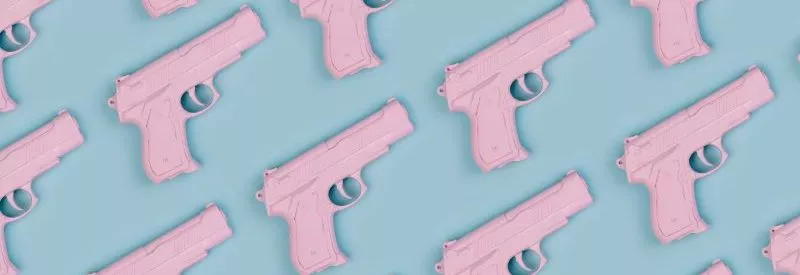 Colorful pastel gun pattern on a blue background for home based FFL requirements.