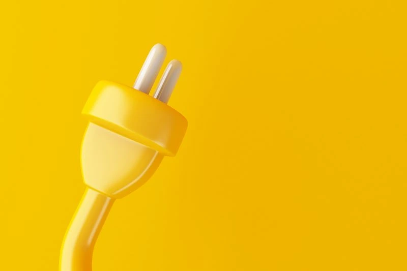 Yellow plug with a yellow background to integrate Stripe to Quickbooks.