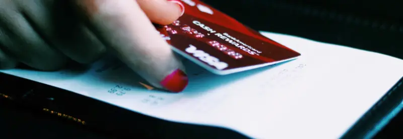 A customer pays with a credit card in an optimized payment system.