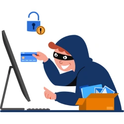 A thief sits at a computer with a credit card in hand, ready to commit merchant fraud.