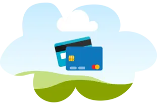 Two credit cards sitting inside of a cloud shaped cutout of the sky.
