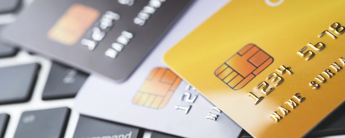 Credit cards lay stacked on each other after a business set up credit card processing.