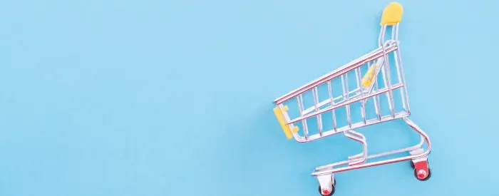 A shopping cart with a blue background for how to cancel a shopify account.