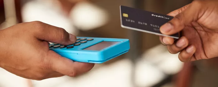 Credit card hands and payment on SumUp Machine