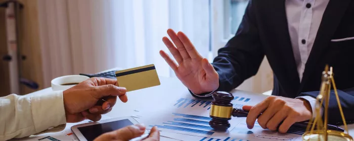 A judge refuses a credit card due to the Visa Chargeback Monitoring Program.
