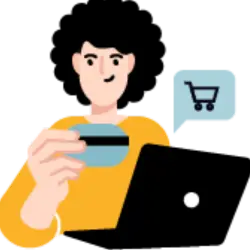 A merchant in front of a laptop with a credit card, selling on shopify..