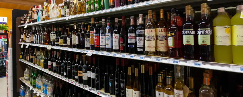 Bottles of alcohol on a shelf sold through a liquor license