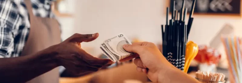 A man buying coffee through a cash discount program.