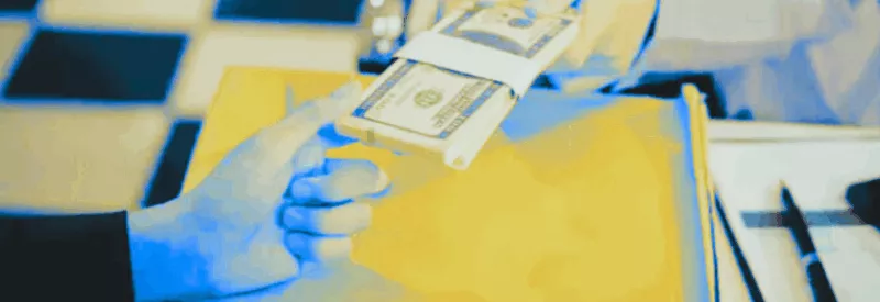 Cash being handed to someone as part of a cash discount program.