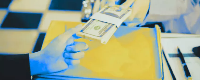 Cash being handed to someone as part of a cash discount program.