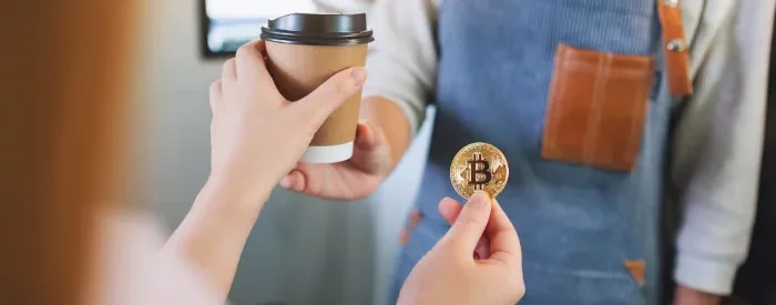 This woman is using bitcon and digital financial services to buy coffee.