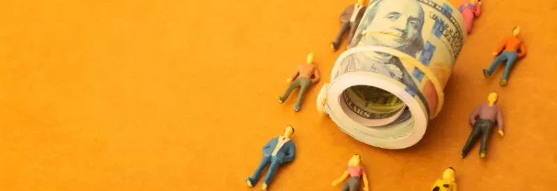 A wad of cash surrounded by merchants handling chargeback management